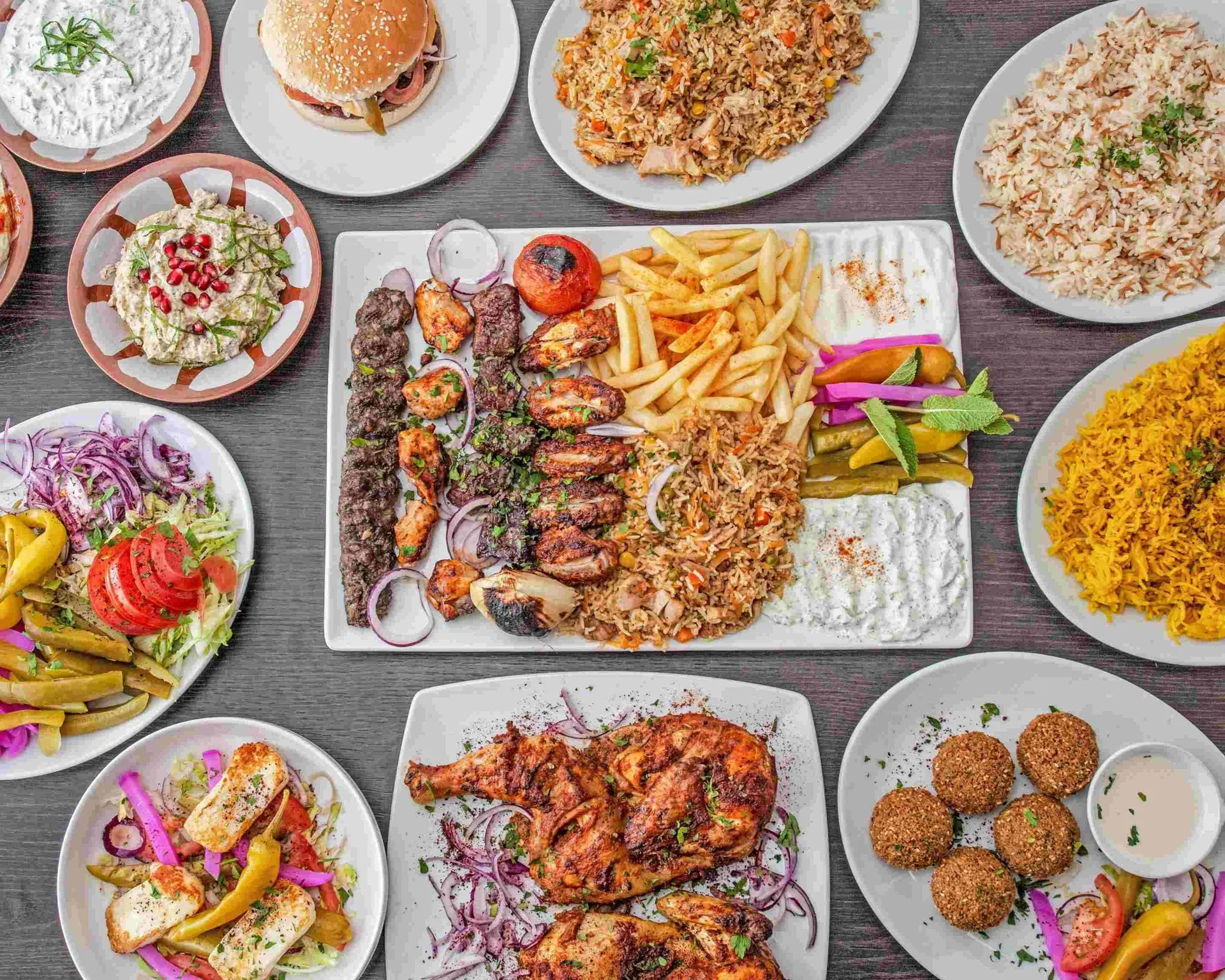 Ali's Cuisine mixed grill platter with lamb and chicken kebabs, rice, salad and sides